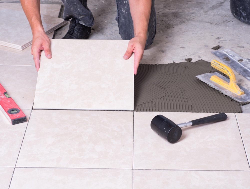 tiler-installing-ceramic-tiles-floor