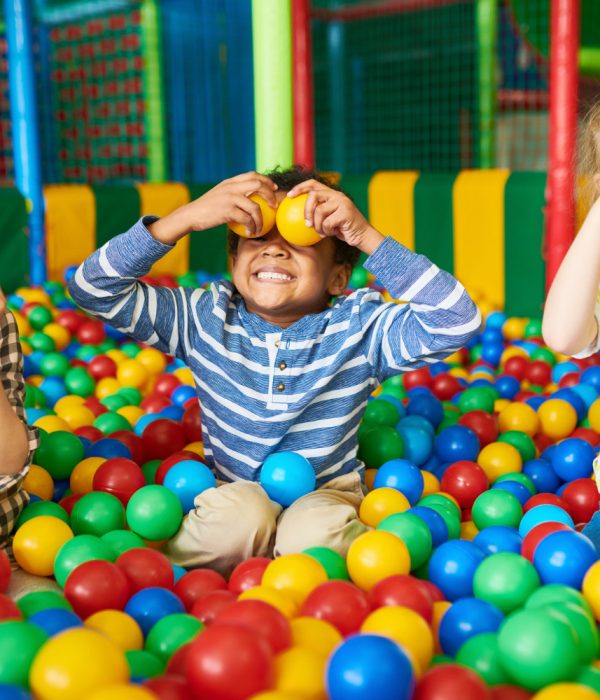 happy-kids-playing-ball-pit