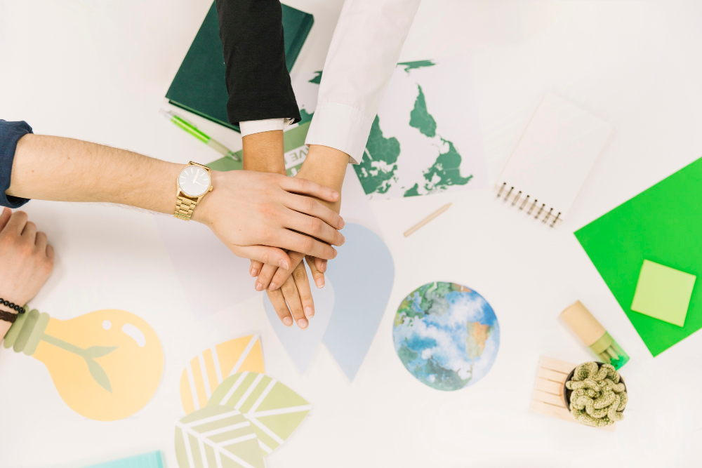 group-businesspeople-stacking-their-hands-desk