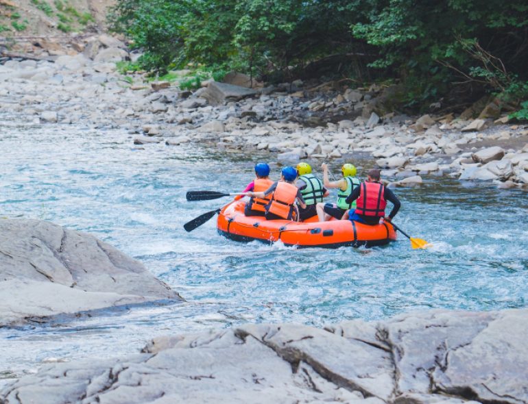 people-rafting-mountain-river-copy-space