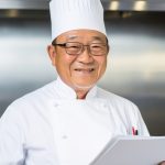 Senior asian man, professional chef at kitchen. Generative AI illustration.